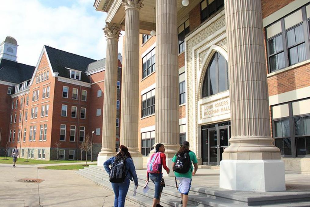 students walking into a building on the Keuka College campus